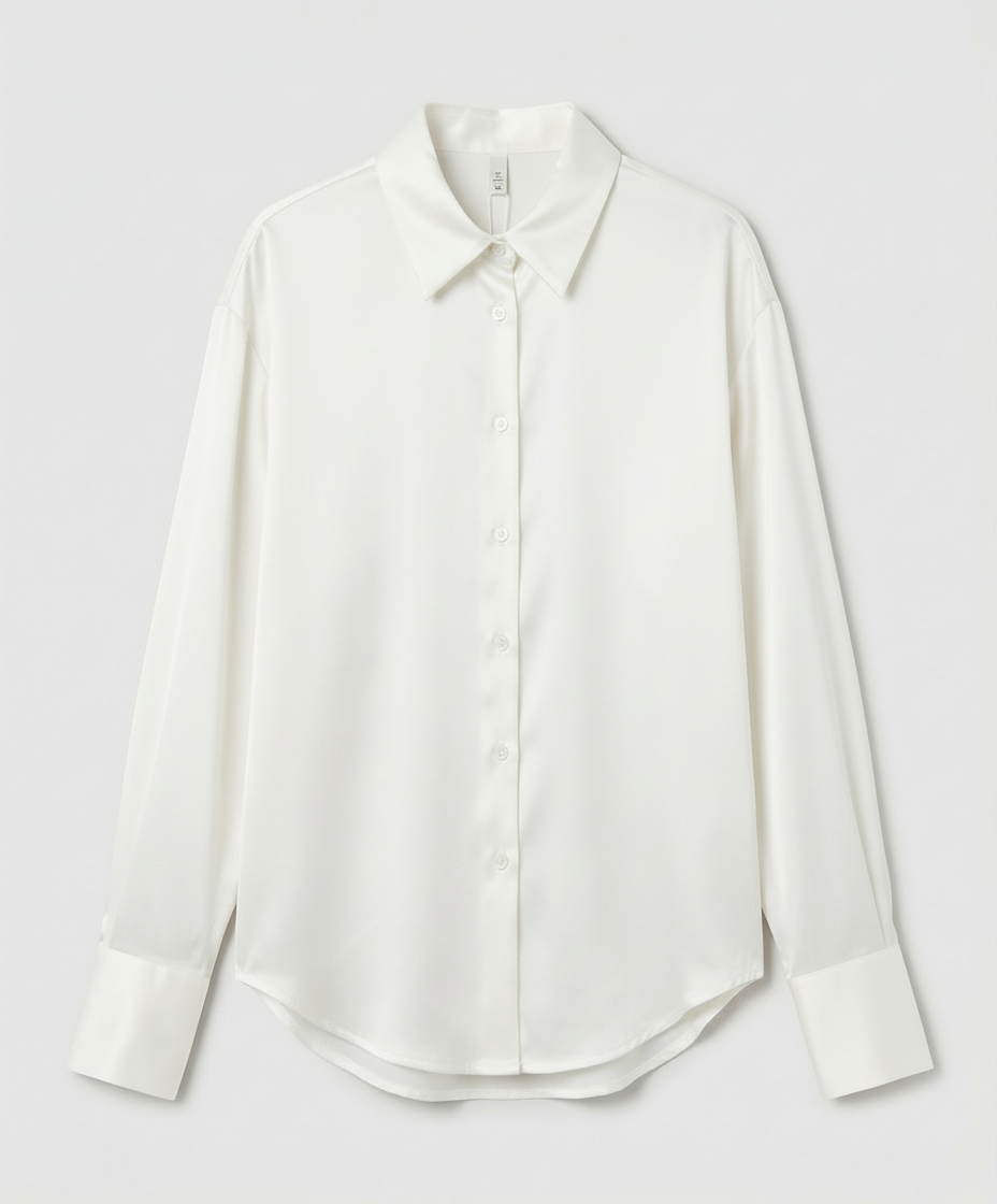 vintage-inspired women’s blouse on a plain background.