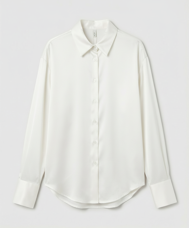 vintage-inspired women’s blouse on a plain background.