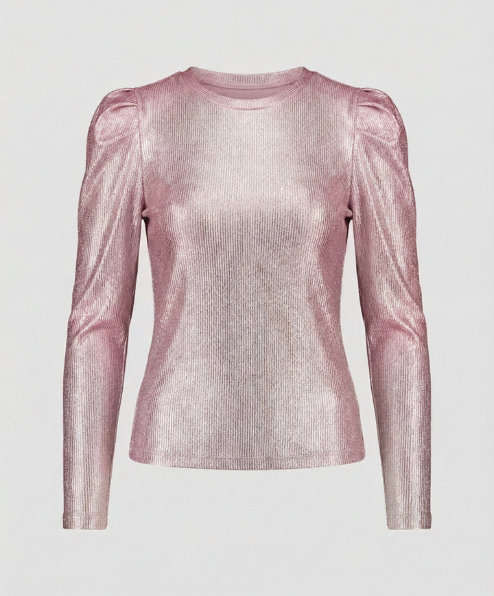 Female model showcasing a glittering blouse with voluminous sleeves and round neckline.
