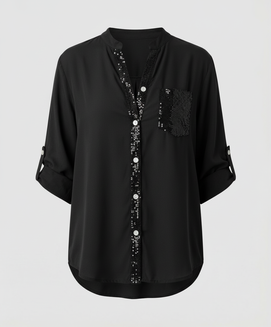Loose-fitting blouse with a decorative sequin chest pocket.