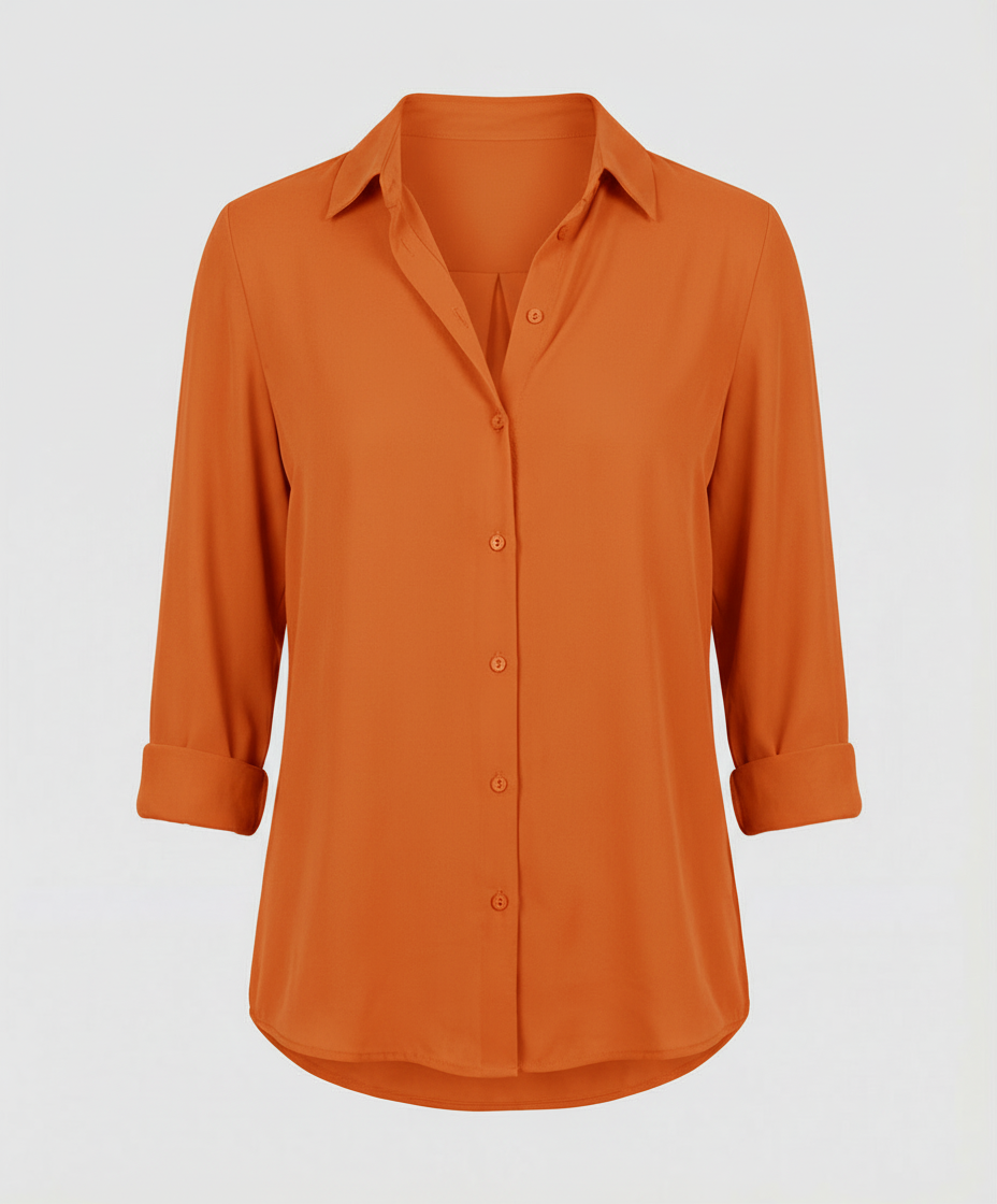 Woman wearing a smart casual blouse with a button-front detail.

