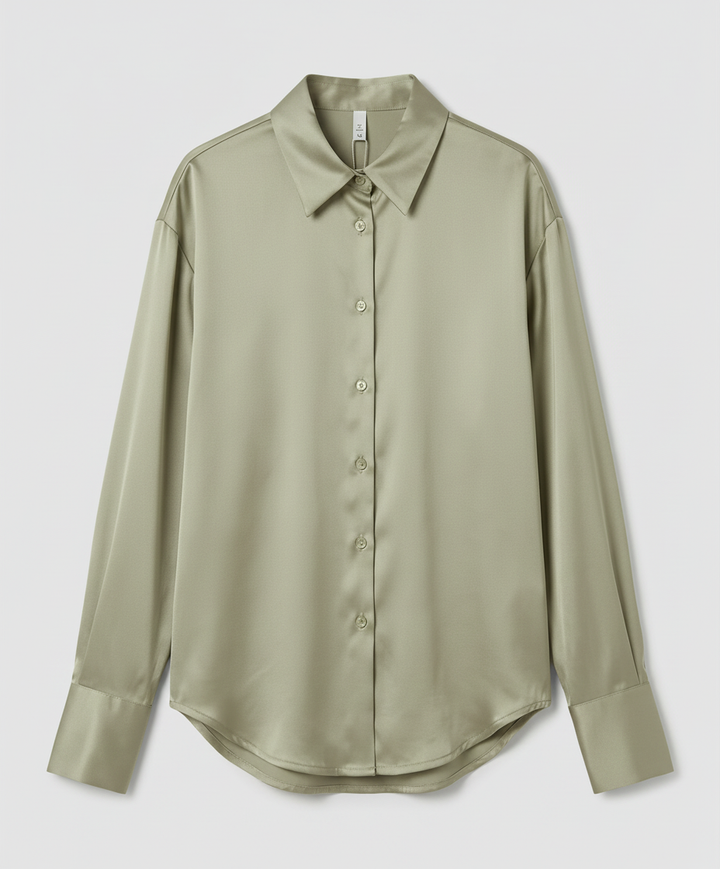 Soft silk shirt with elegant styling against a plain background.