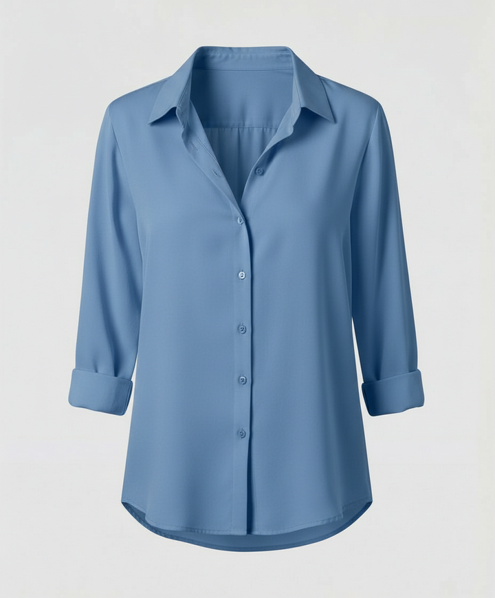 Female model showcasing an elegant blouse with a traditional collar and long sleeves.
