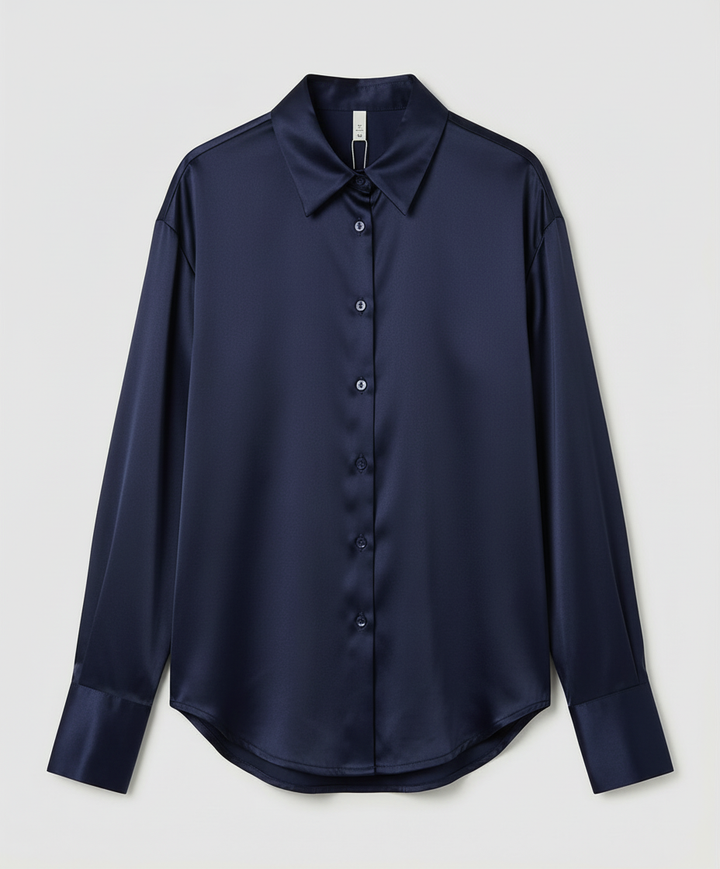 Cassic blouse for dressy outfits on a plain background.
