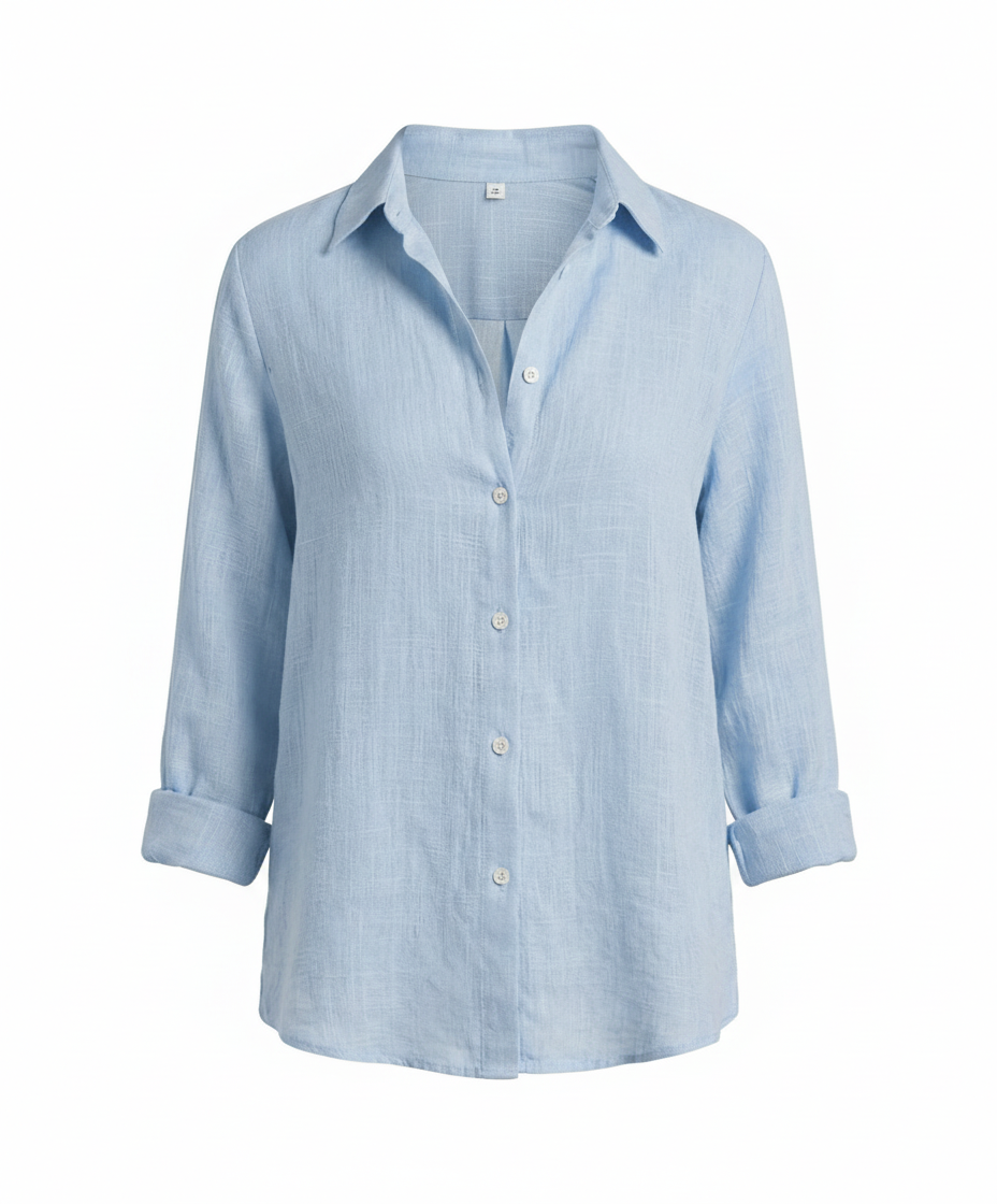 Female model wearing a versatile V-neck top with refined finishing on a plain background.
