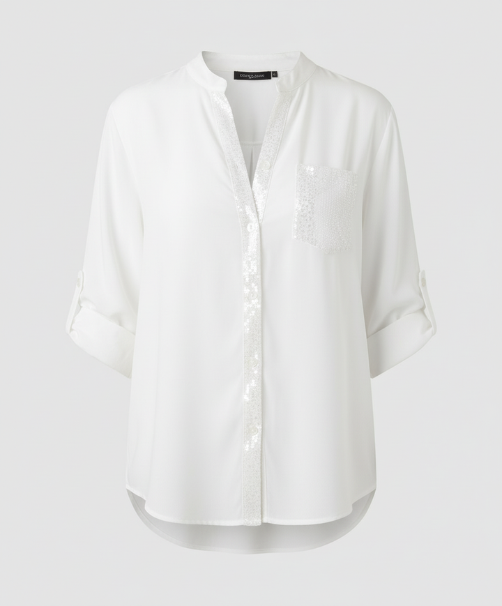 Casual long-sleeve blouse with a shimmering pocket accent.