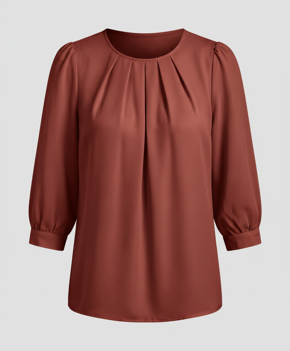 Woman styled in a satin blouse with subtle shine and classic tailoring.

