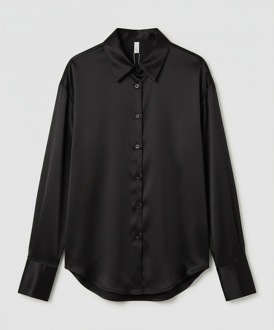 Female model wearing a refined blouse with a flattering fit against a plain background.