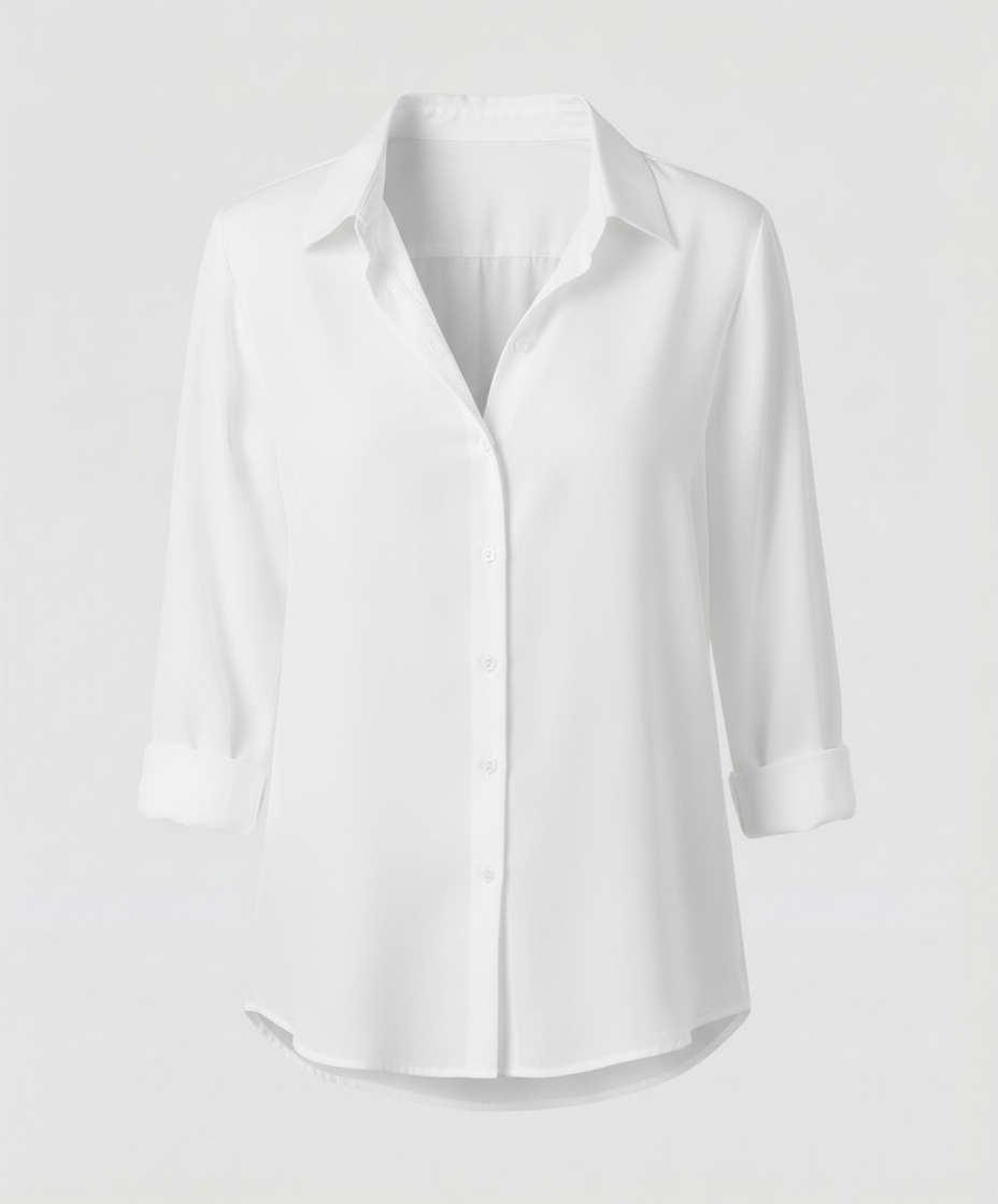 Female model wearing a collared blouse with a clean and refined look.