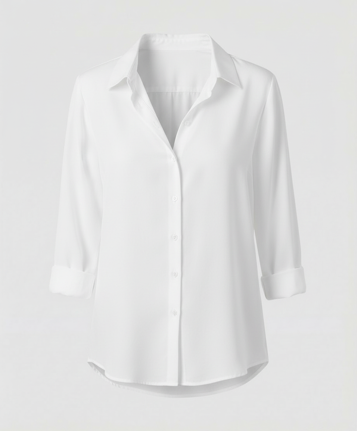 Female model wearing a collared blouse with a clean and refined look.