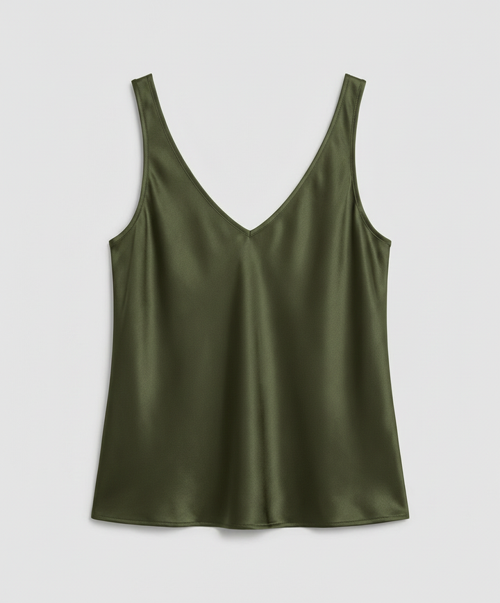 Female model showcasing a classic everyday top with a clean silhouette.
