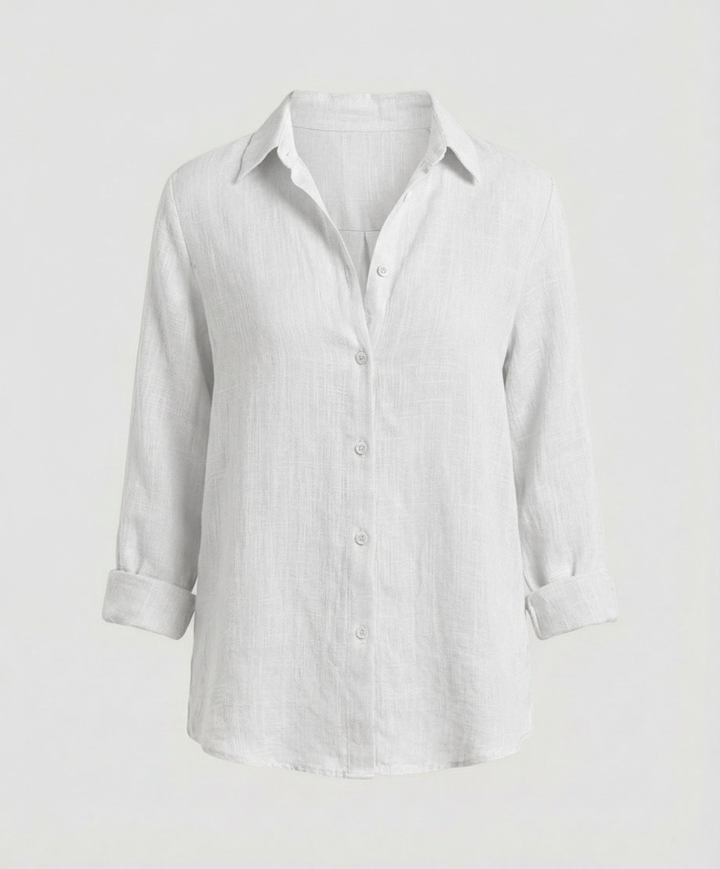 Female model wearing a smart blouse with a V-neck design and clean silhouette.