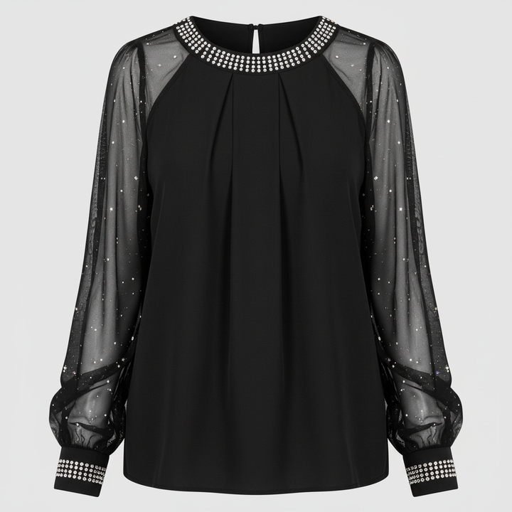 Female model wearing a long sleeve mesh top with decorative sequins and a regular fit.