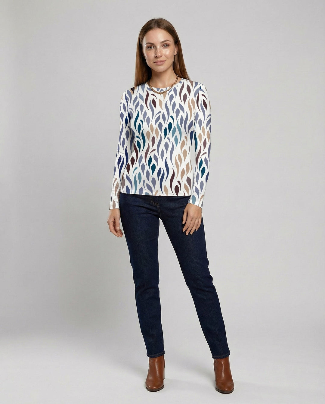 Woman showcasing a casual T-shirt with a flattering fit against a plain background.