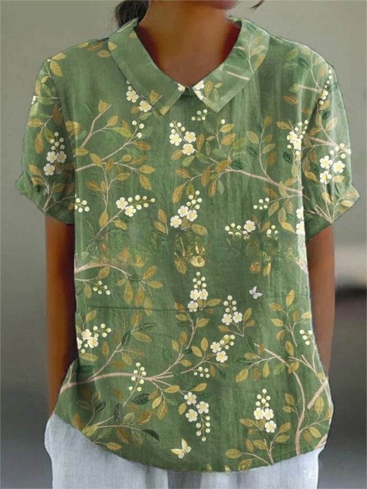  Model displaying a floral shirt with a relaxed and stylish fit on a plain background.