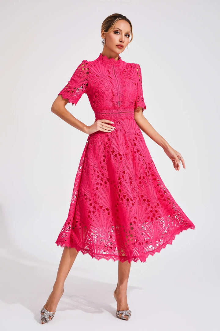 Woman model in a mock neck lace midi dress with a flattering silhouette on a clean background.