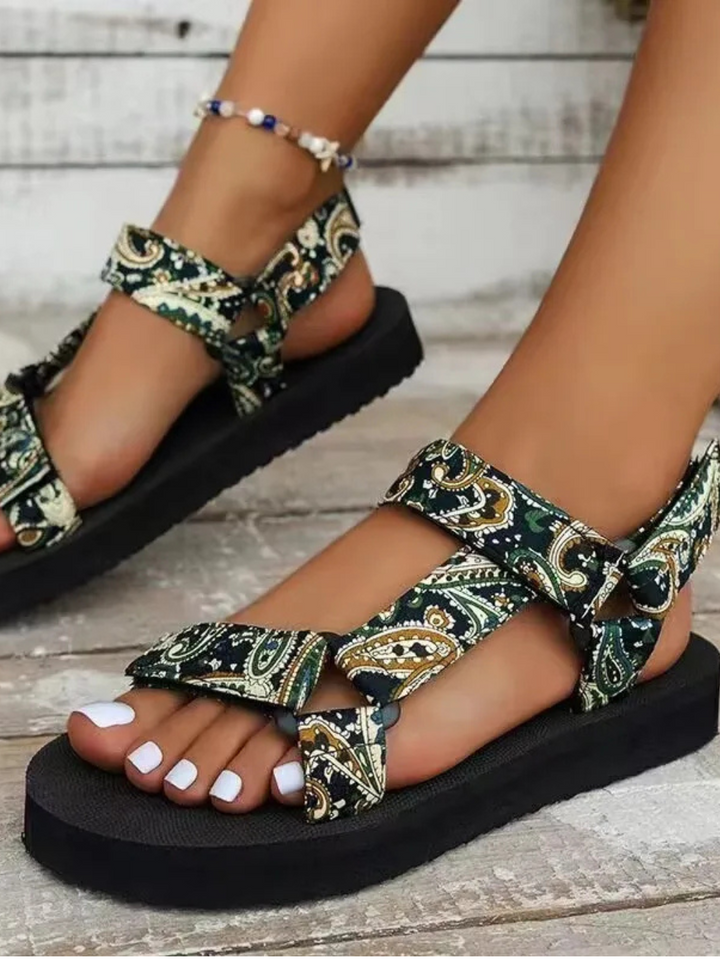 Women's flat sandal side profile clean background minimal stylish look