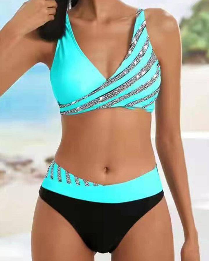 Female model in a flattering bikini against a clean beach background for vacation swimwear style.