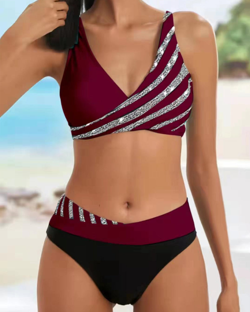 Female model wearing a warm bikini set against a beach background for poolside style.