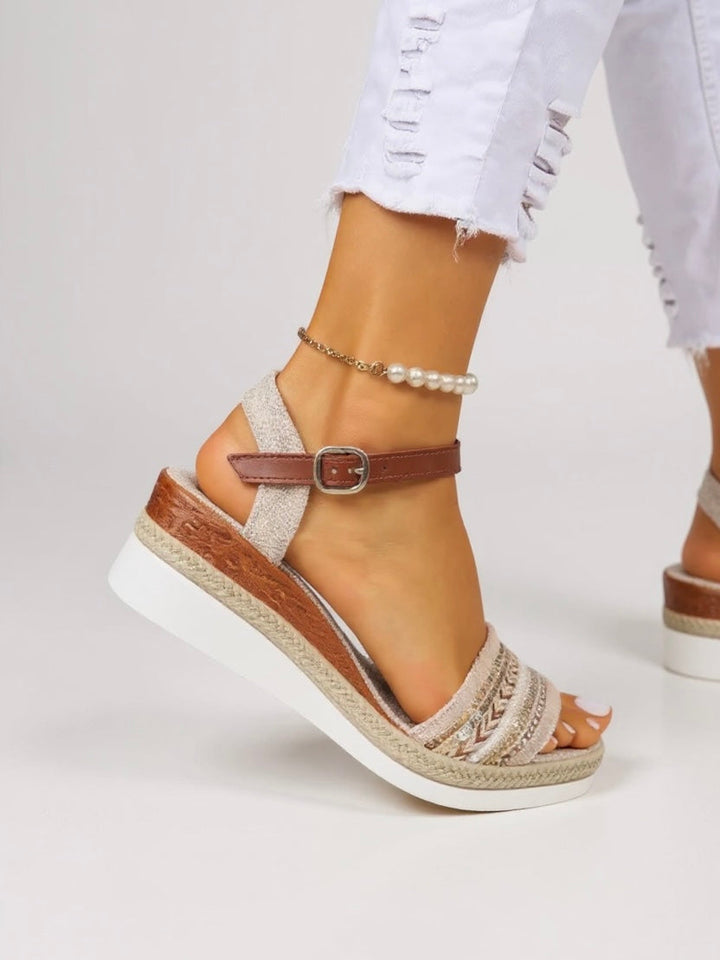 Comfortable wedge heel sandals worn by a model with a clean background.