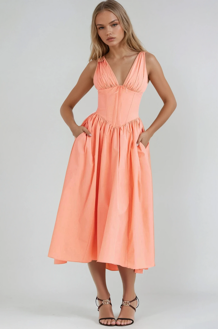 Lightweight formal dress for warm weather styling shown on a plain background.