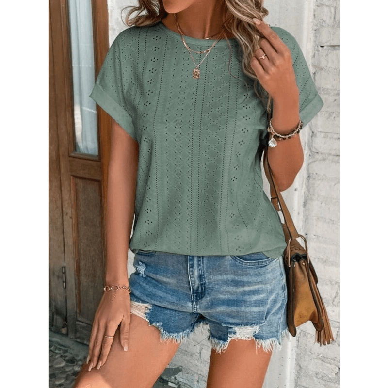 Woman wearing embroidered short sleeve blouse
