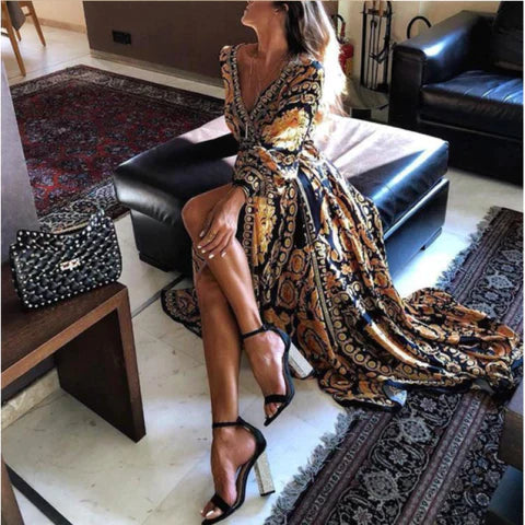 Female showcasing a boho wrap dress with belted waist on a plain background.