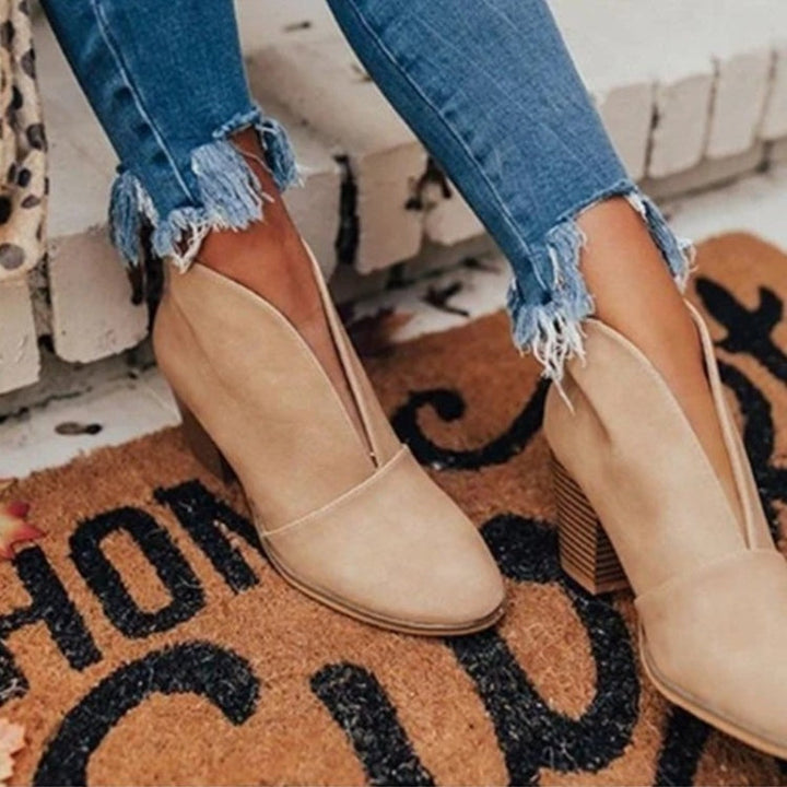 light grey heels on a carpet