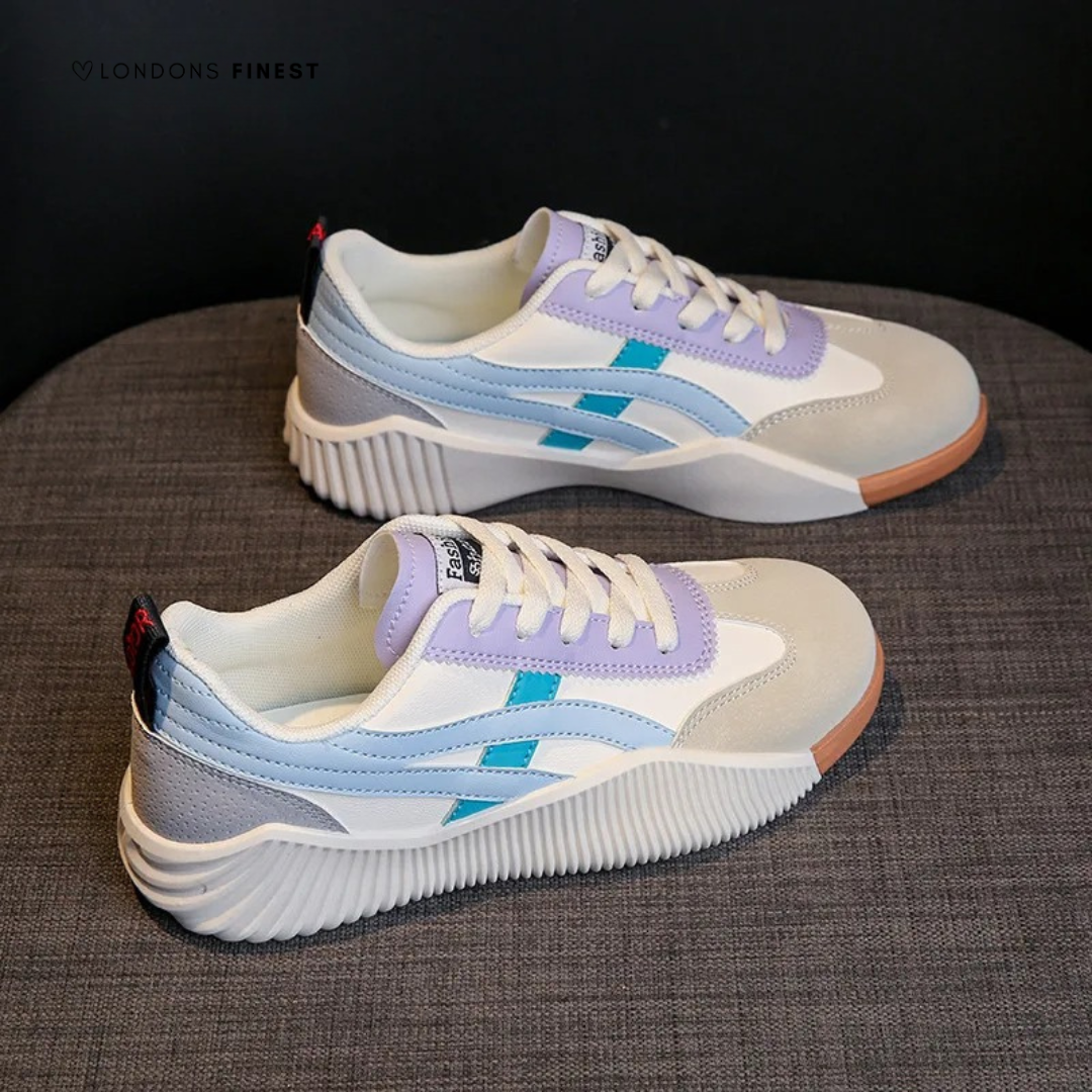 Cushioned walking shoes pair displayed on gray surface and dark background