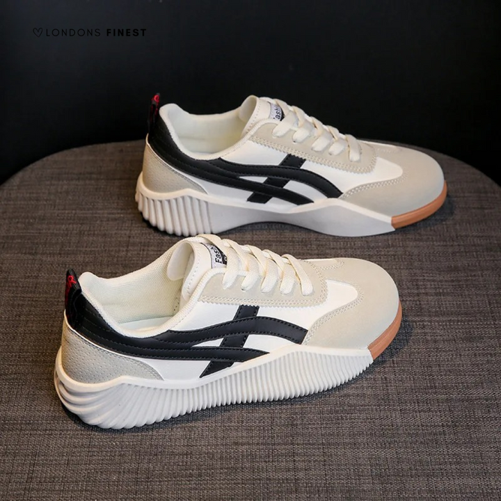 White supportive sneakers side view on dark background