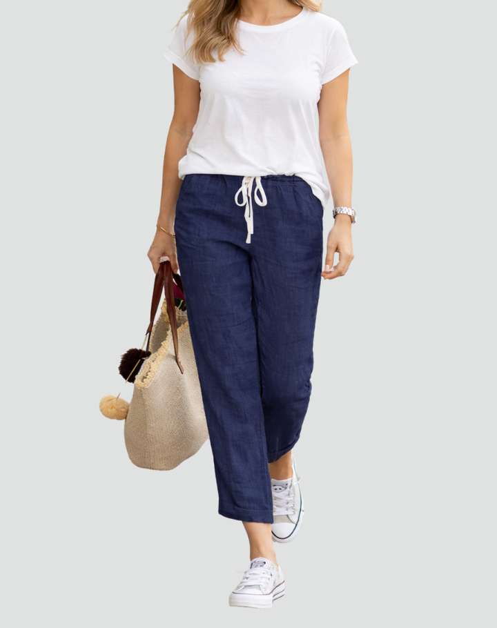  Model wearing lightweight trousers designed for everyday wear