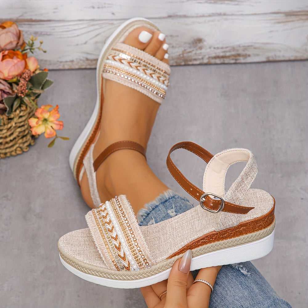 Close up foot model showing rhinestone sandals front plain background