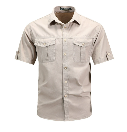  Man wearing a casual utility button shirt with flap pockets on a plain background.