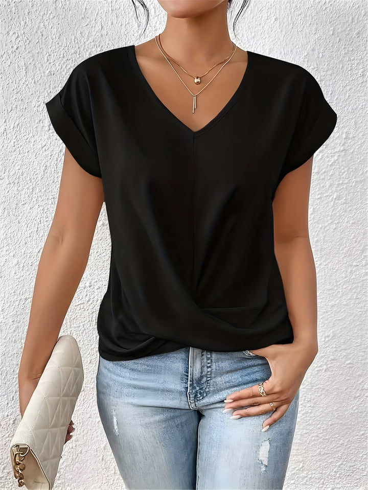 Stylish V-neck twist front women’s top with model on a clean background