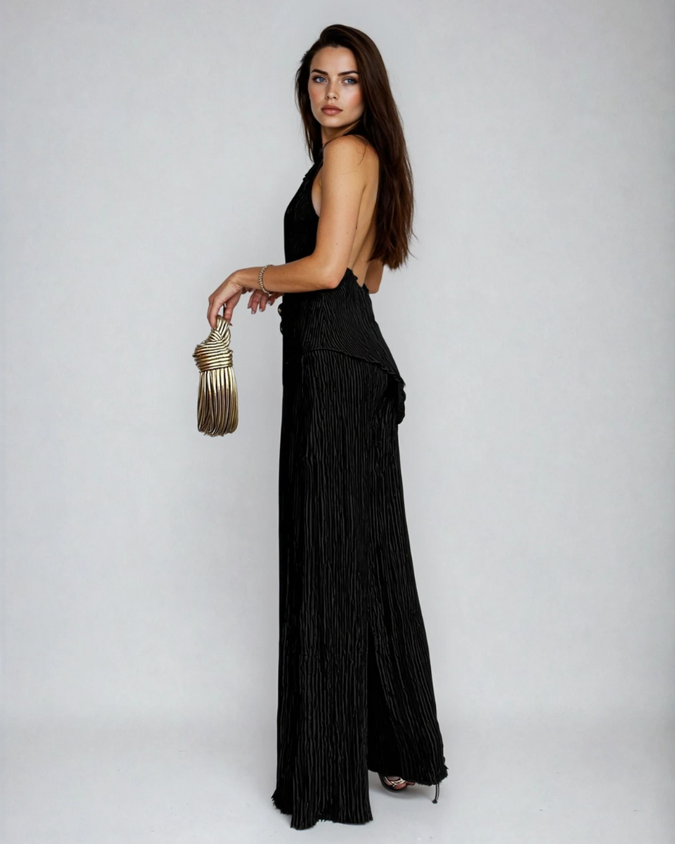 Female model showing a halter neckline pleated matching set on a plain background.