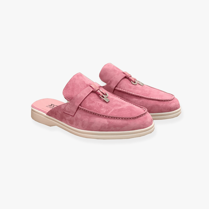 Casual mules with relaxed pose plain background.