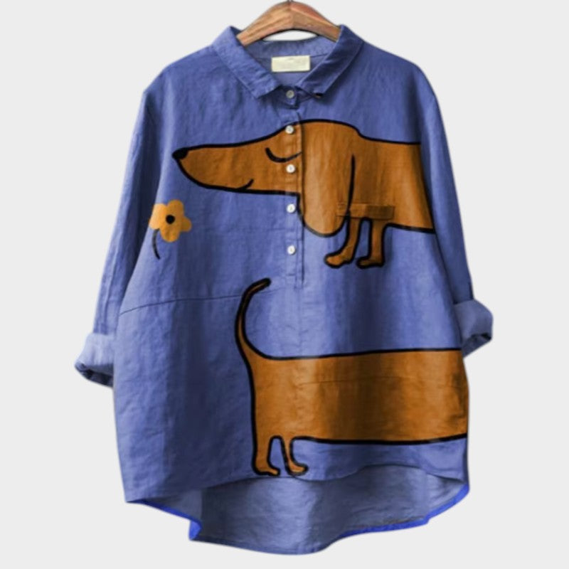 Woman wearing oversized shirt with playful dog print on a clean background