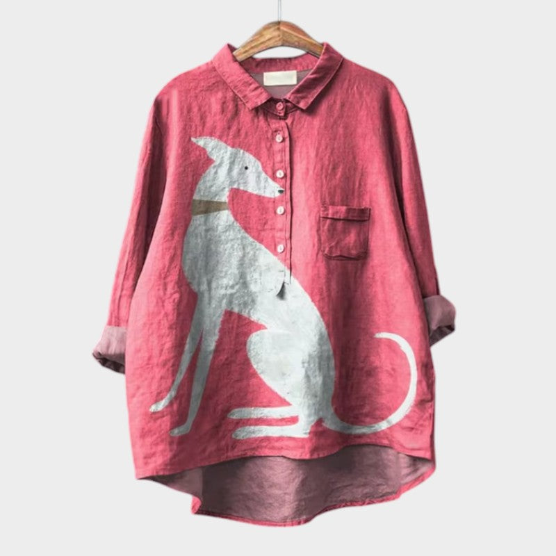 Female model in relaxed fit oversized blouse styled casually on plain background