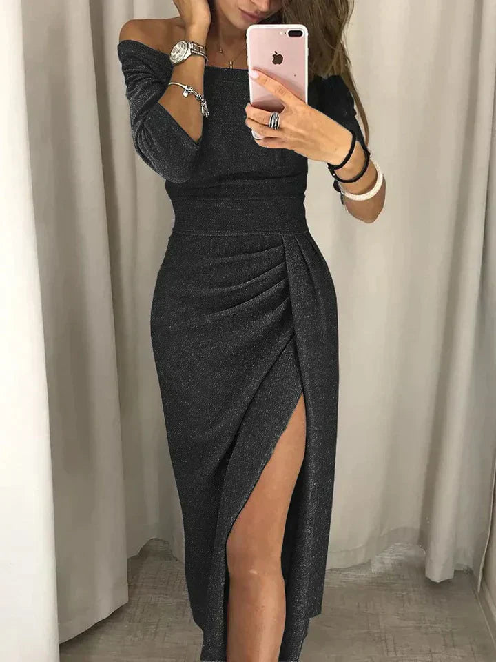 Woman wearing an off-shoulder midi dress with a wrap-front design on a plain background.