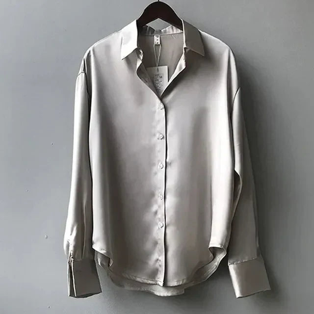 A polished satin blouse suitable for office and daily wear.