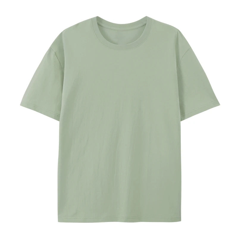 Woman in a casual oversized cotton T-shirt styled with a loose silhouette on a plain background.
