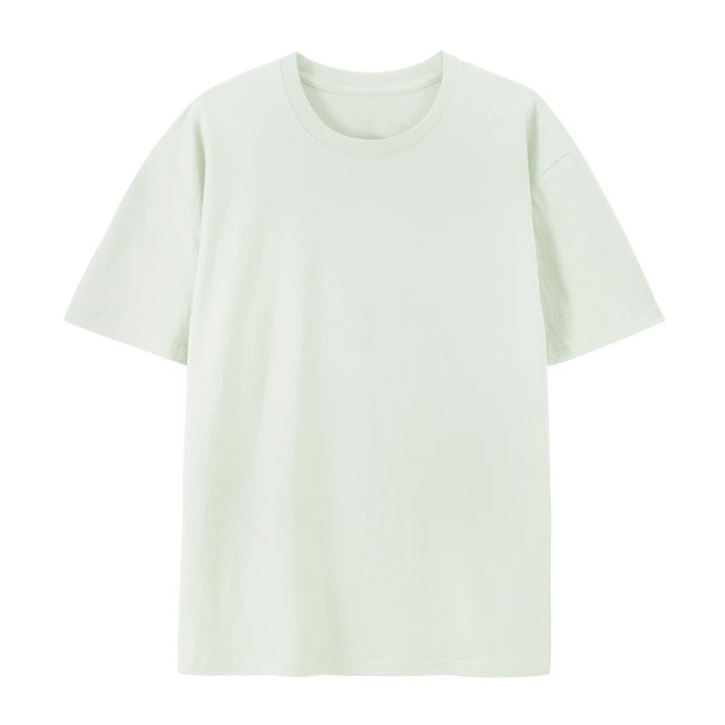 Female model wearing an oversized casual T-shirt with short sleeves on a plain background.
