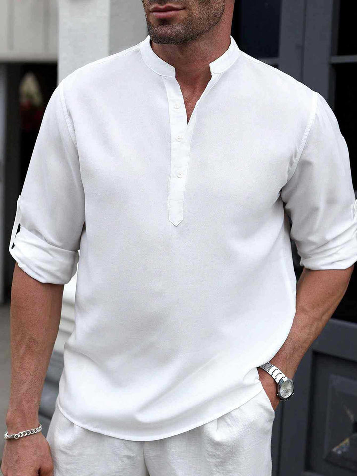Male model wearing a modern casual button-up shirt against a plain background.
