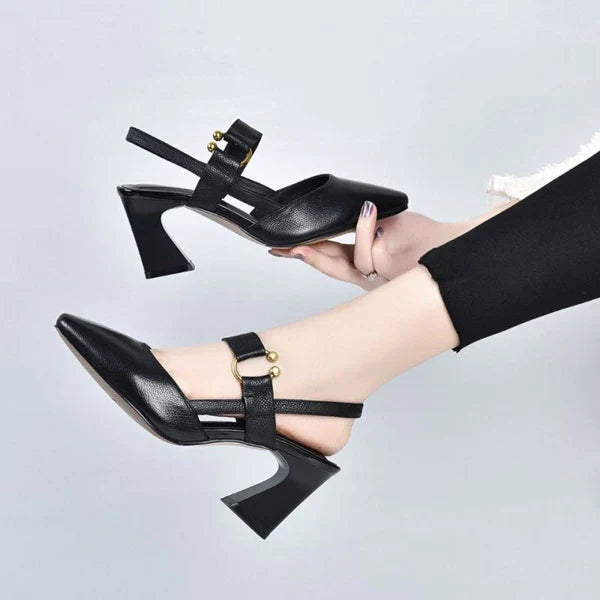 Side profile sandals on plain background worn by foot model