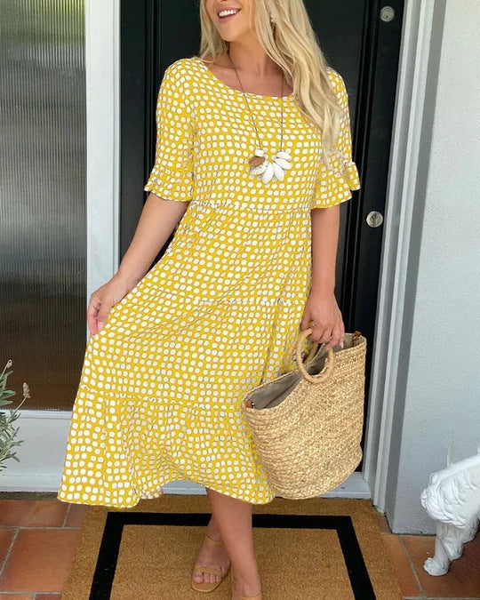 Front angle yellow midi dress with woven bag