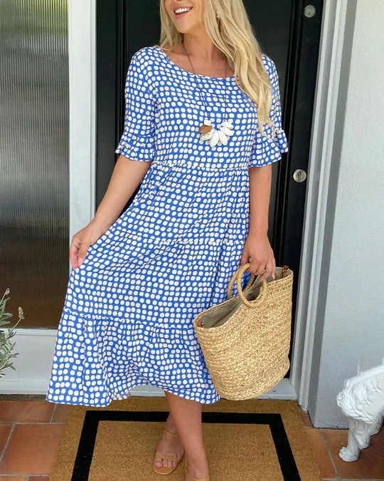 Tiered blue dress paired with woven handbag summer