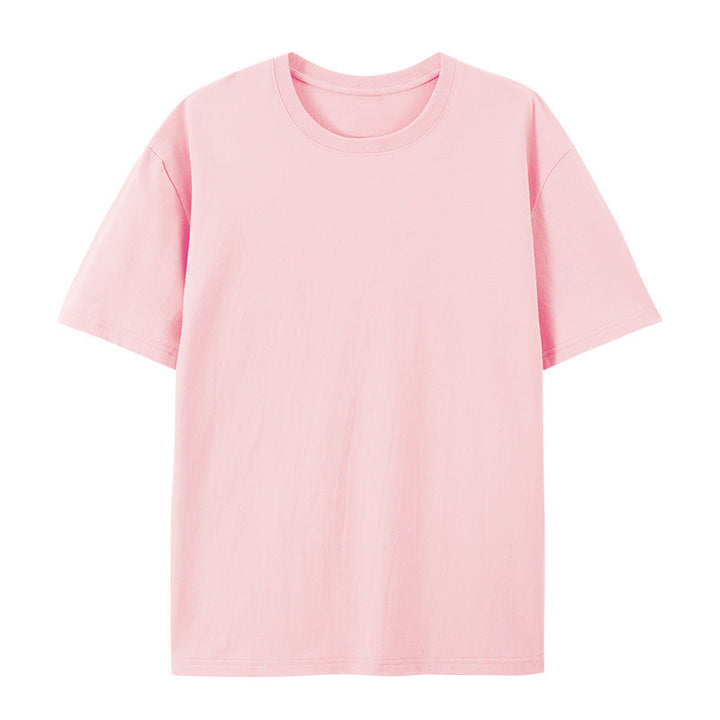 Female model wearing a loose oversized T-shirt paired with a casual look against a plain background.
