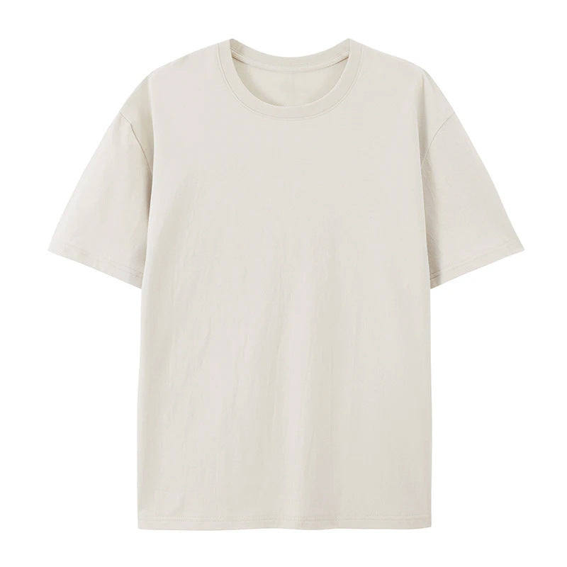 Female model in an oversized short-sleeve T-shirt with a relaxed shape and clean design.
