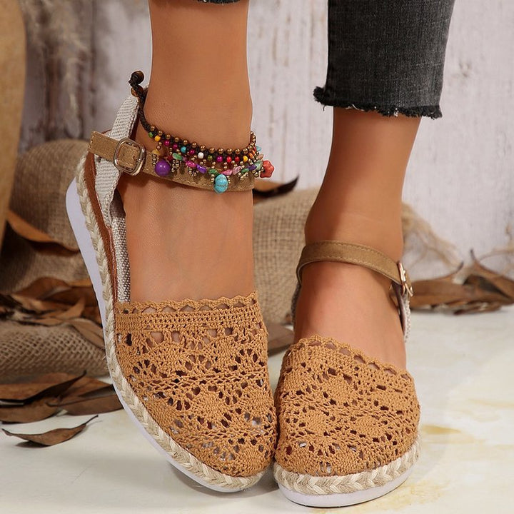 Angled front view espadrilles on foot clean plain background