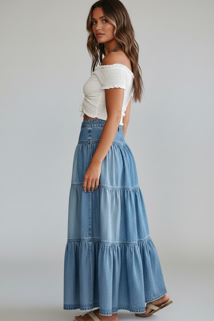 Female side pose in denim maxi skirt 